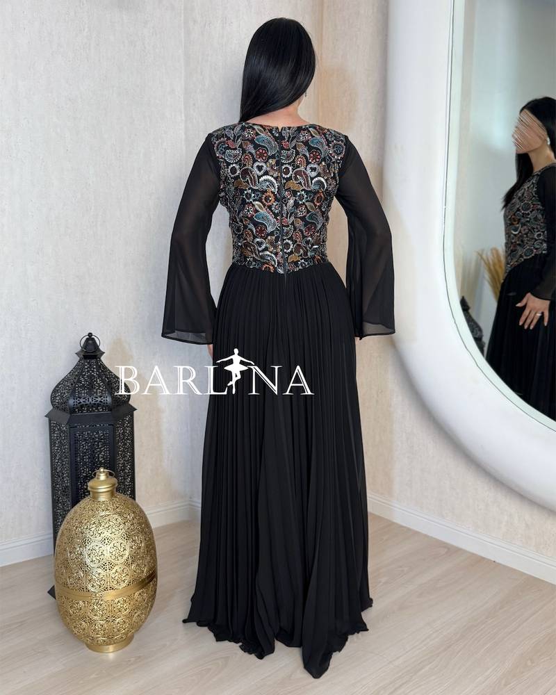 Black pleated jalabiya with an embroidered bodice