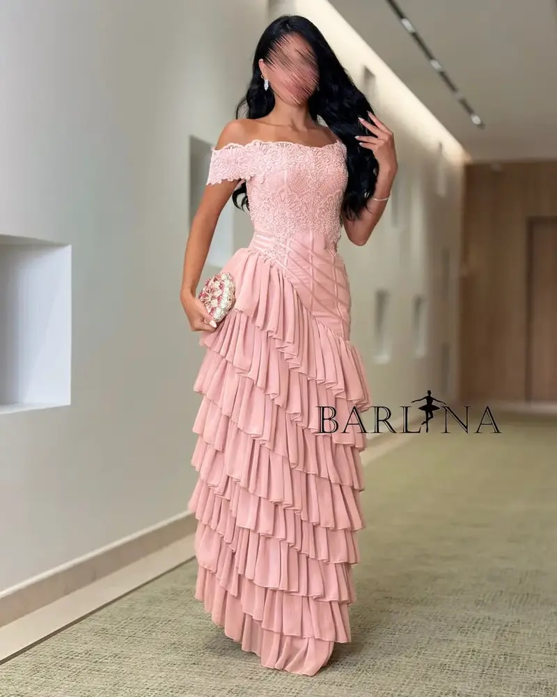 A pink dress with soft ruffles and a touch of lace.