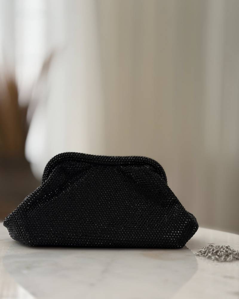 Elegant black handbag studded with rhinestones