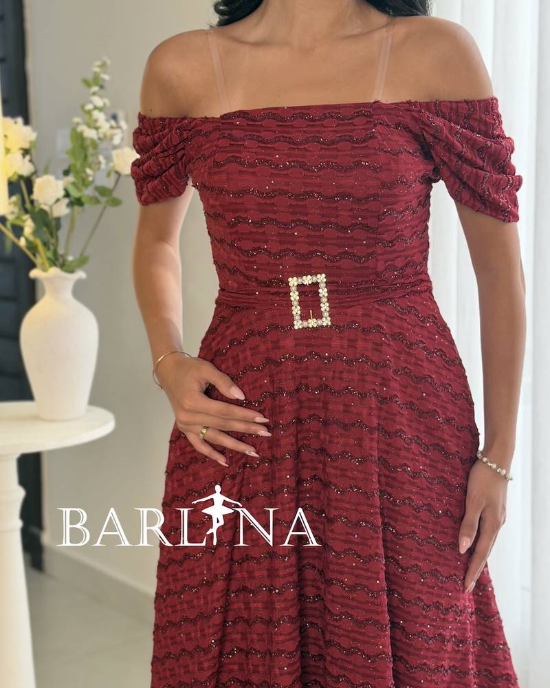 A burgundy dress with a patterned glossy fabric