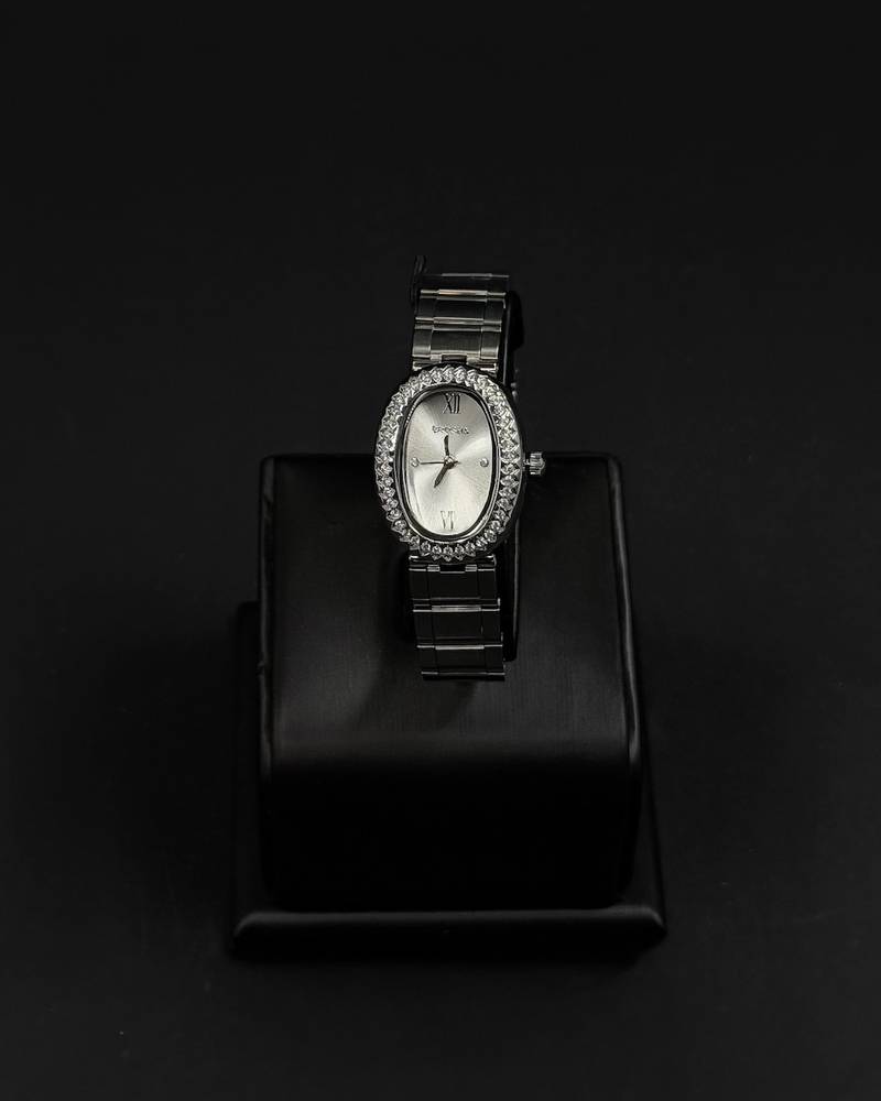 An oval-shaped watch surrounded by crystal
