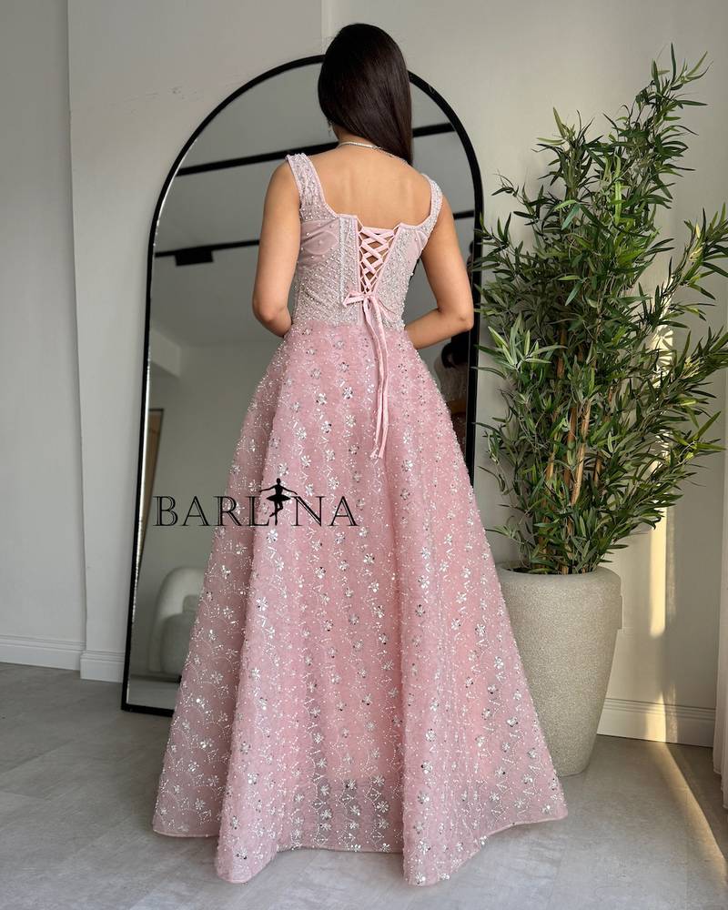 Pink dress embroidered with shimmering silver details