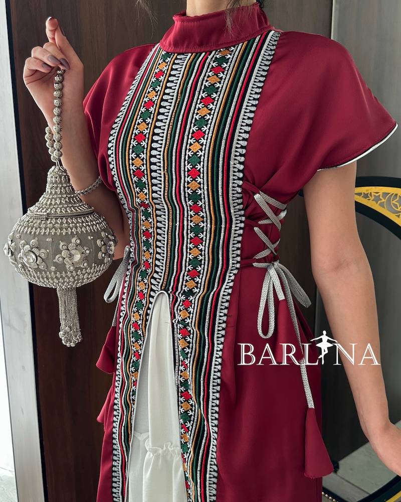 Maroon jalabiya decorated with Sadu patterns
