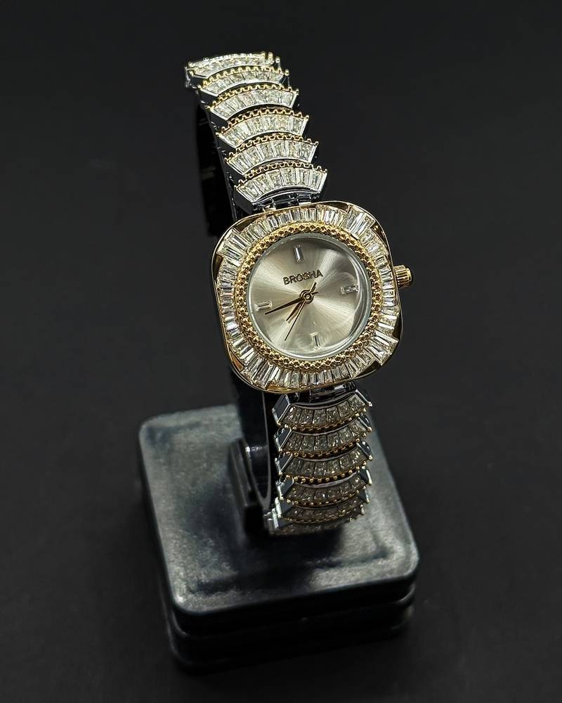 watch with a rounded square frame adorned with crystals