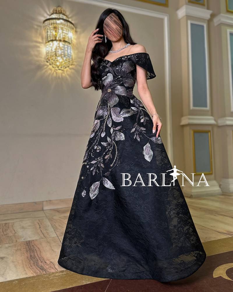 Black dress embroidered with leaf patterns