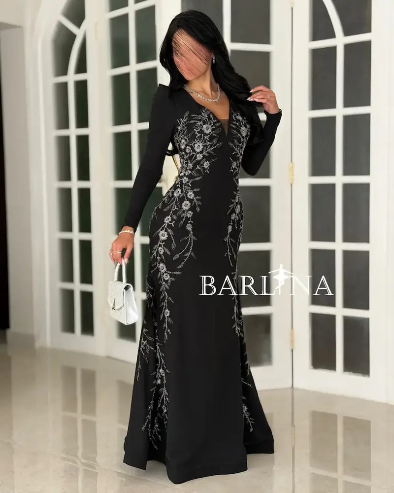 Black dress embroidered with silver details