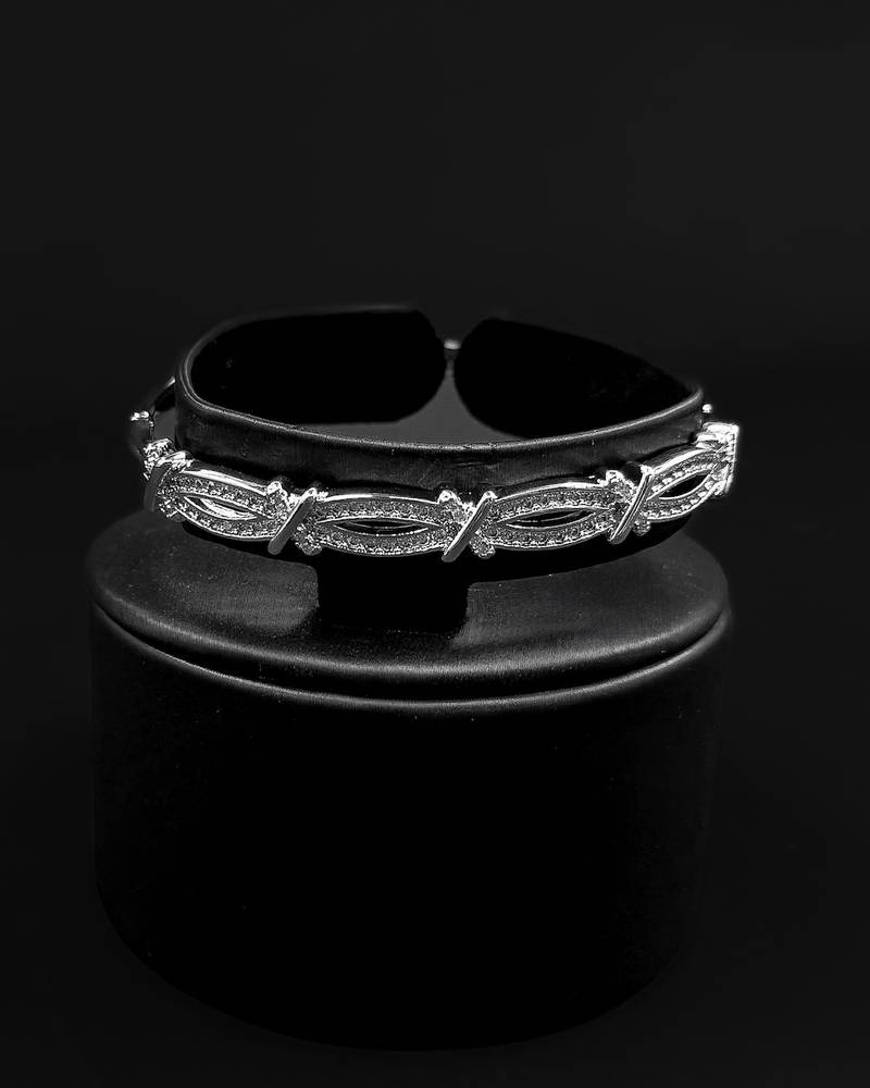Bracelet and ring with a modern interlocking design