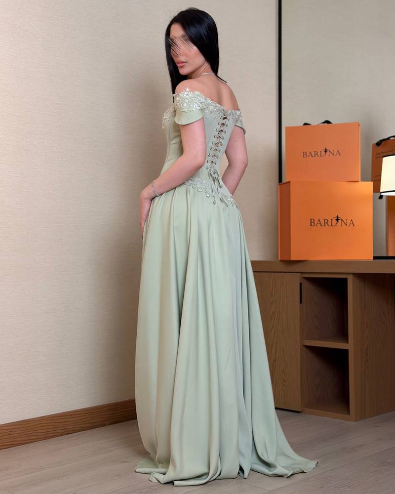 Luxurious light green off-the-shoulder evening dress
