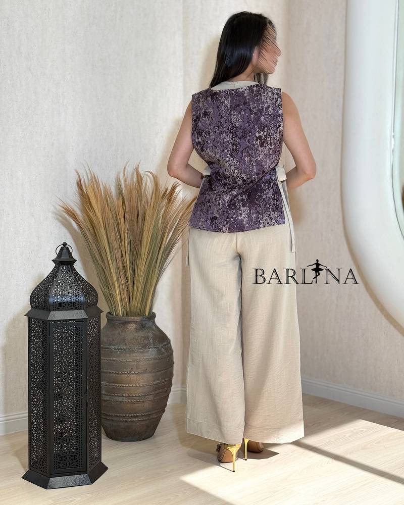 Beige jumpsuit with delicate details