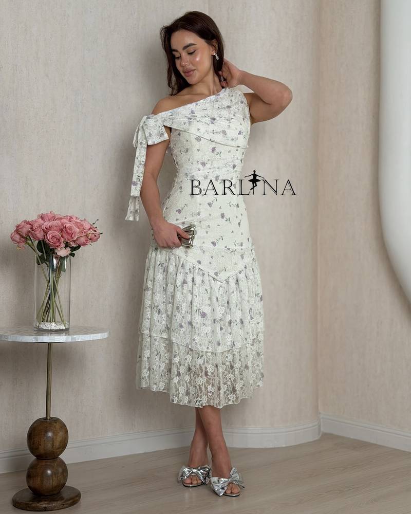 A dress with delicate details and light lace layers