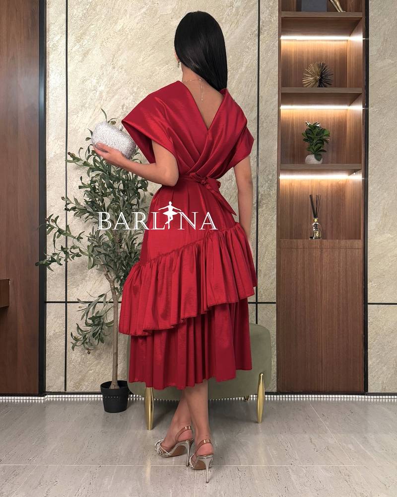 Elegant red layered dress with broad shoulders