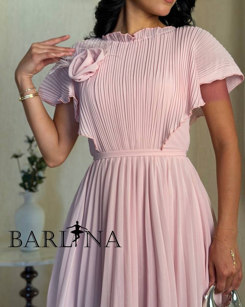 Pink pleated midi dress with a side rose