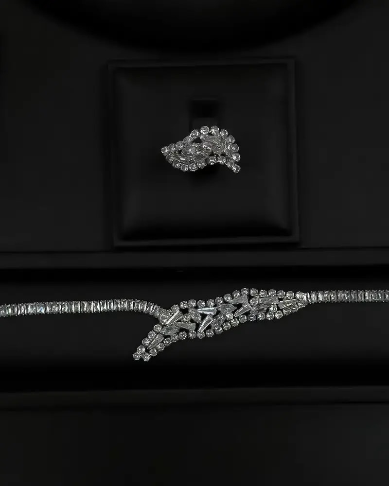 An accessory set with a streamlined asymmetrical design.