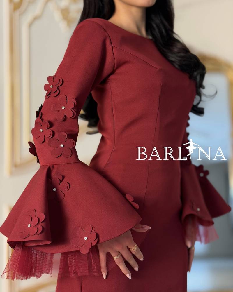Burgundy dress with wide sleeves adorned with roses