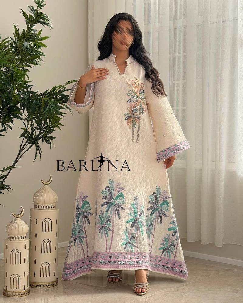 Ivory-colored jalabiya decorated with palm tree embroidery