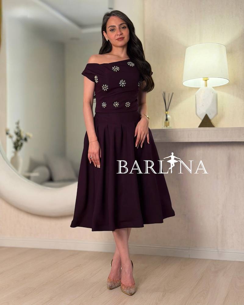 Dark purple dress with crystal embellishments