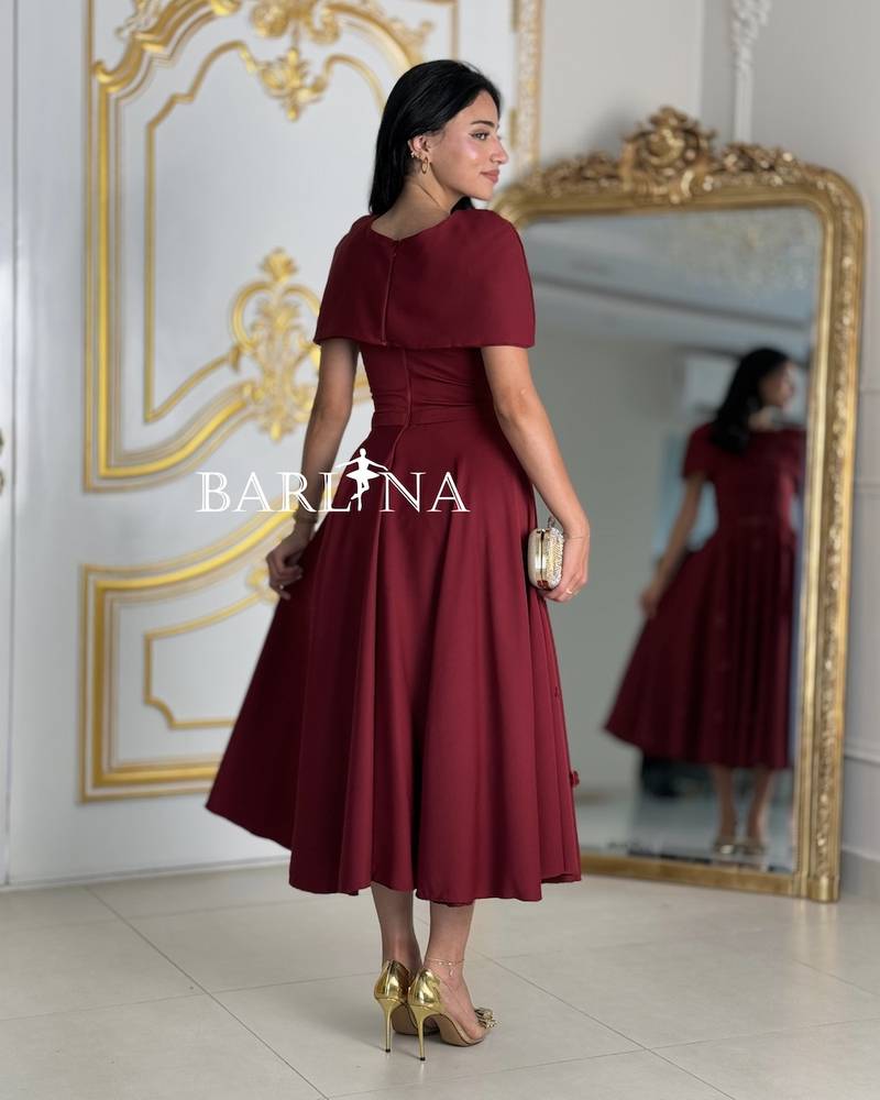 Loose burgundy dress with a covered neckline