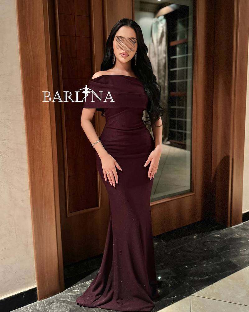Elegant dark burgundy dress with a simple train