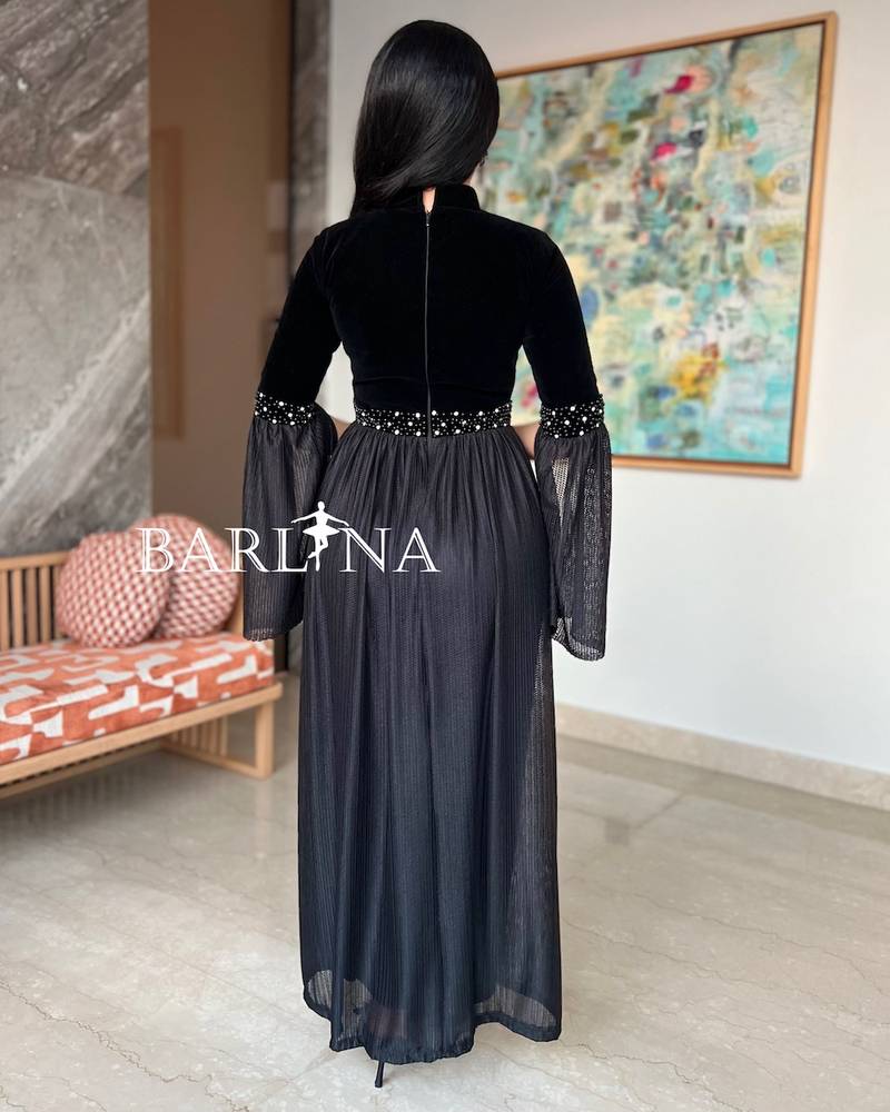 Black dress with open sleeves decorated with pearls