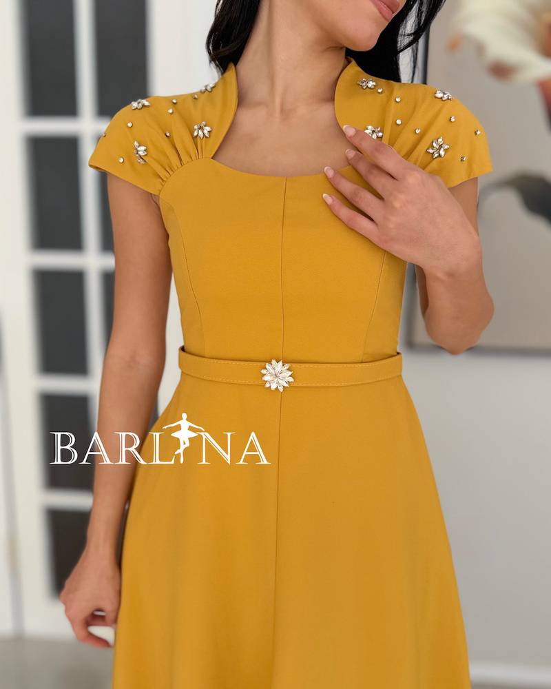 A soft dress adorned with delicate details