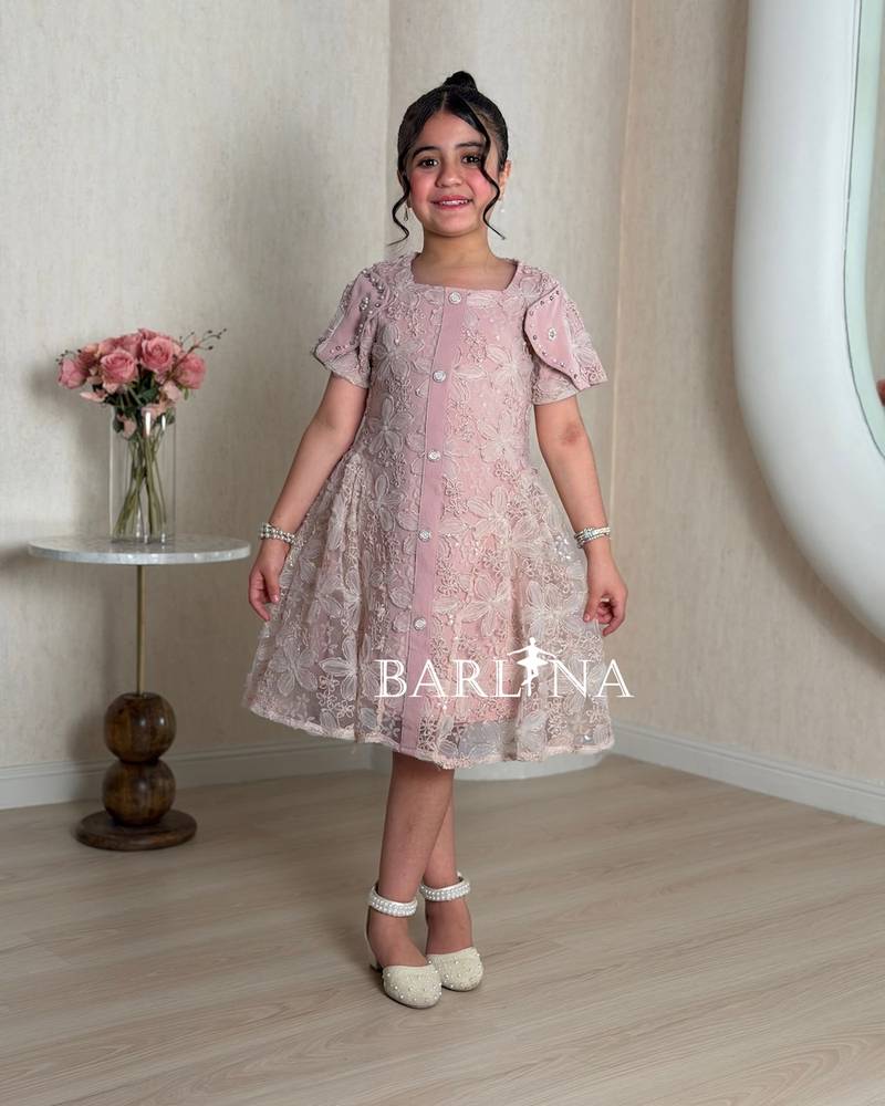 Pink girls' dress with a sheer overlay decorated with roses