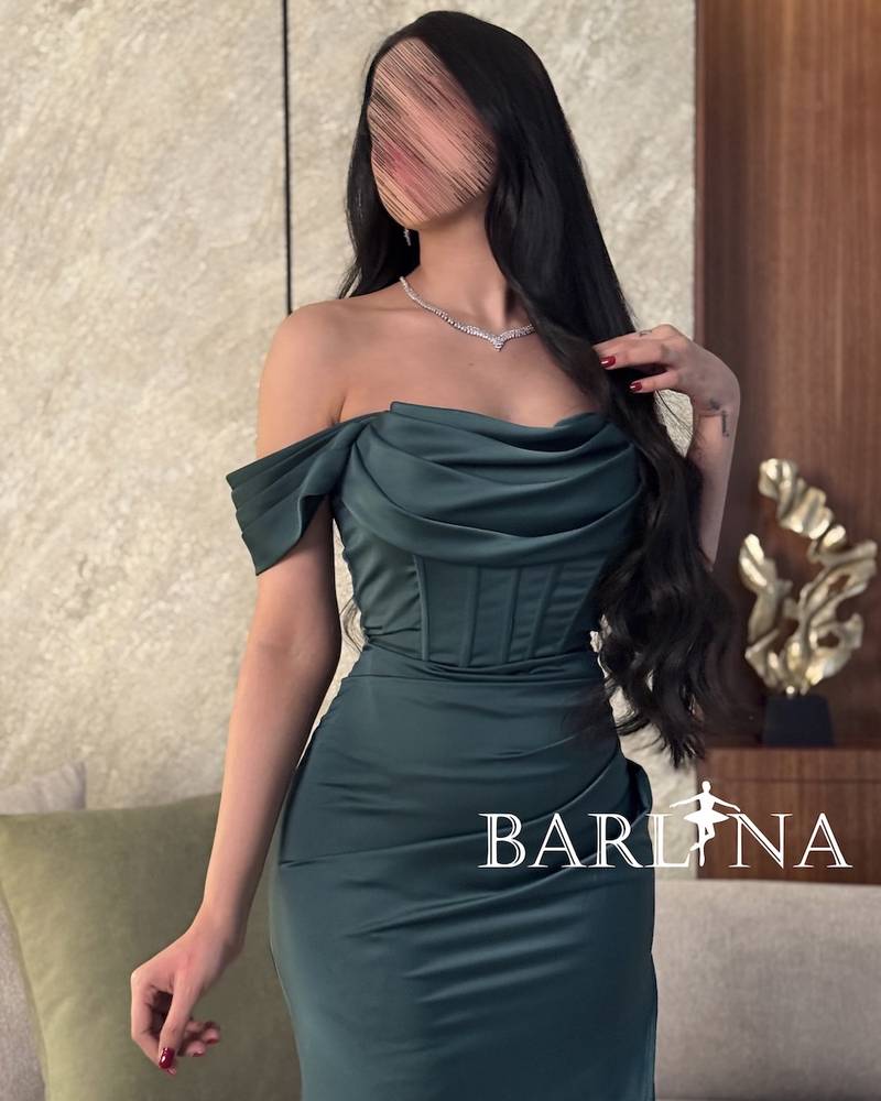 Green evening dress with corset design and front slit