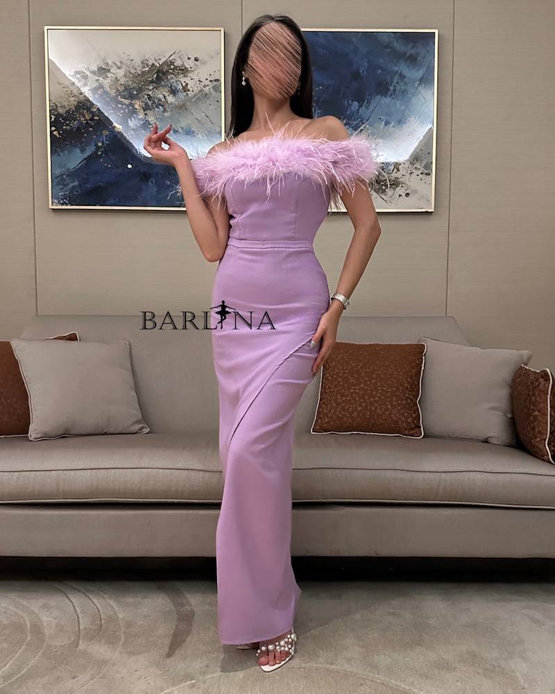 Long purple dress with off-shoulder feathers