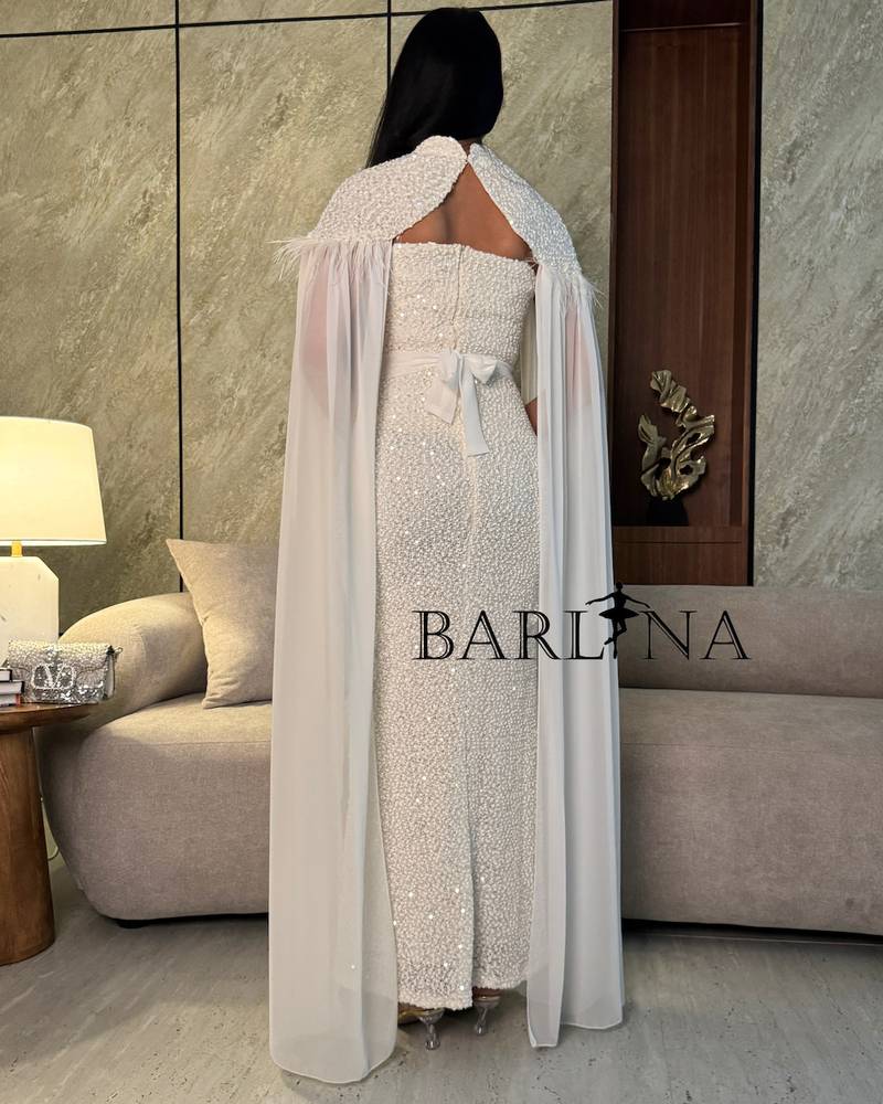 White dress with pearl embroidery and a transparent cape