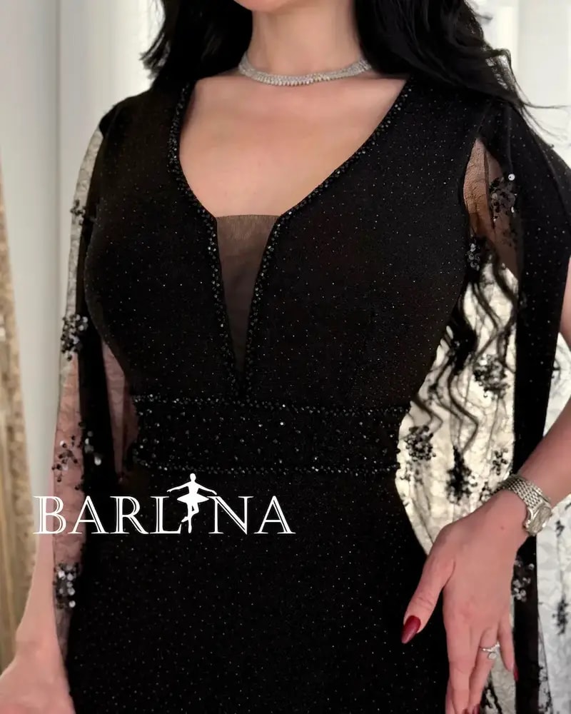 فستان سهرة أسود بقطعة شفافة مزخرفة