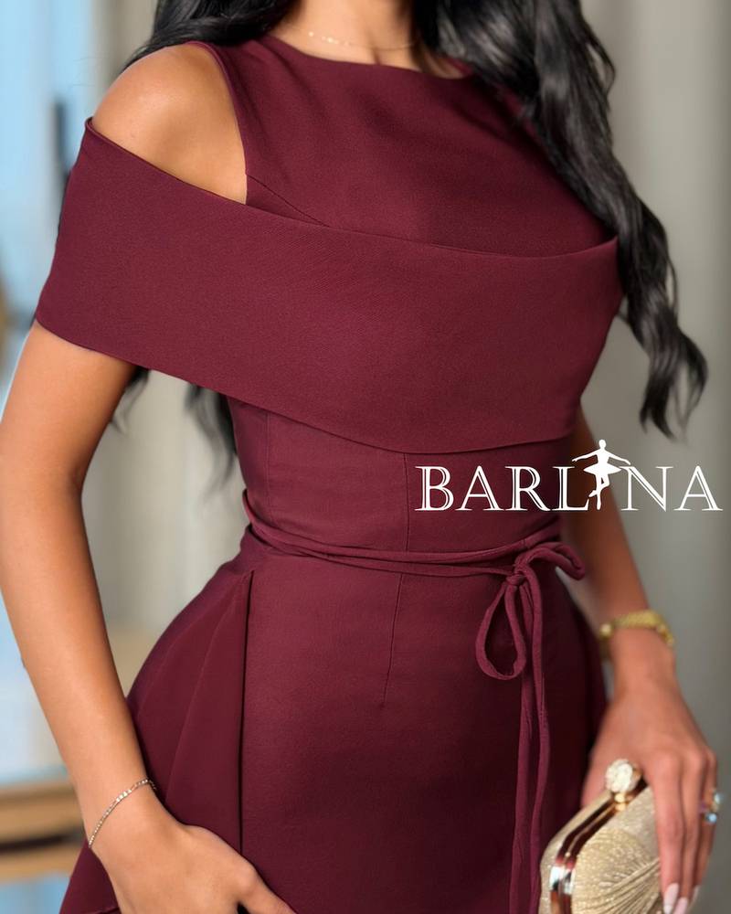A soft burgundy dress with elegant side ruffles