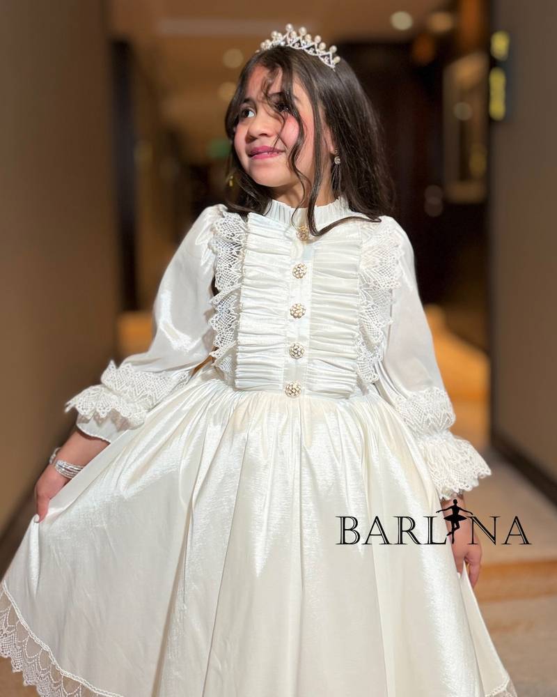 Off-white girls' dress with front ruffles