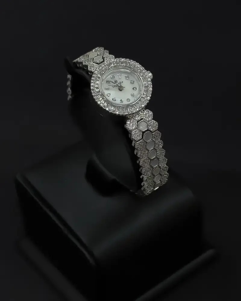 A luxurious women's watch adorned with sparkling stones