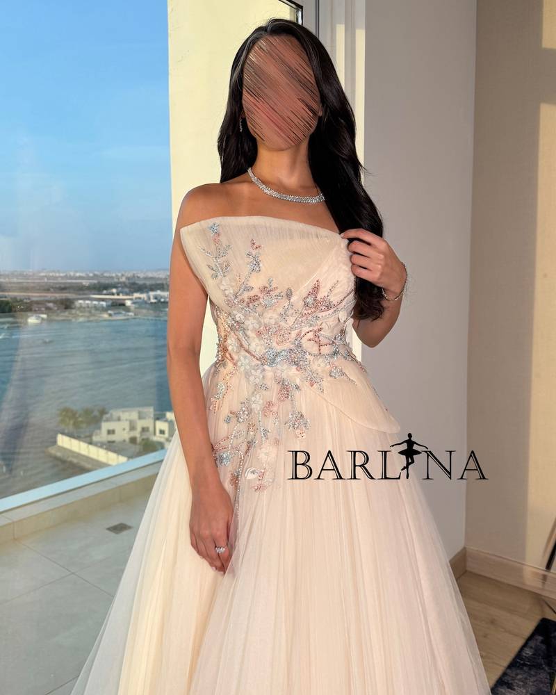 Light beige dress with intricate floral embroidery