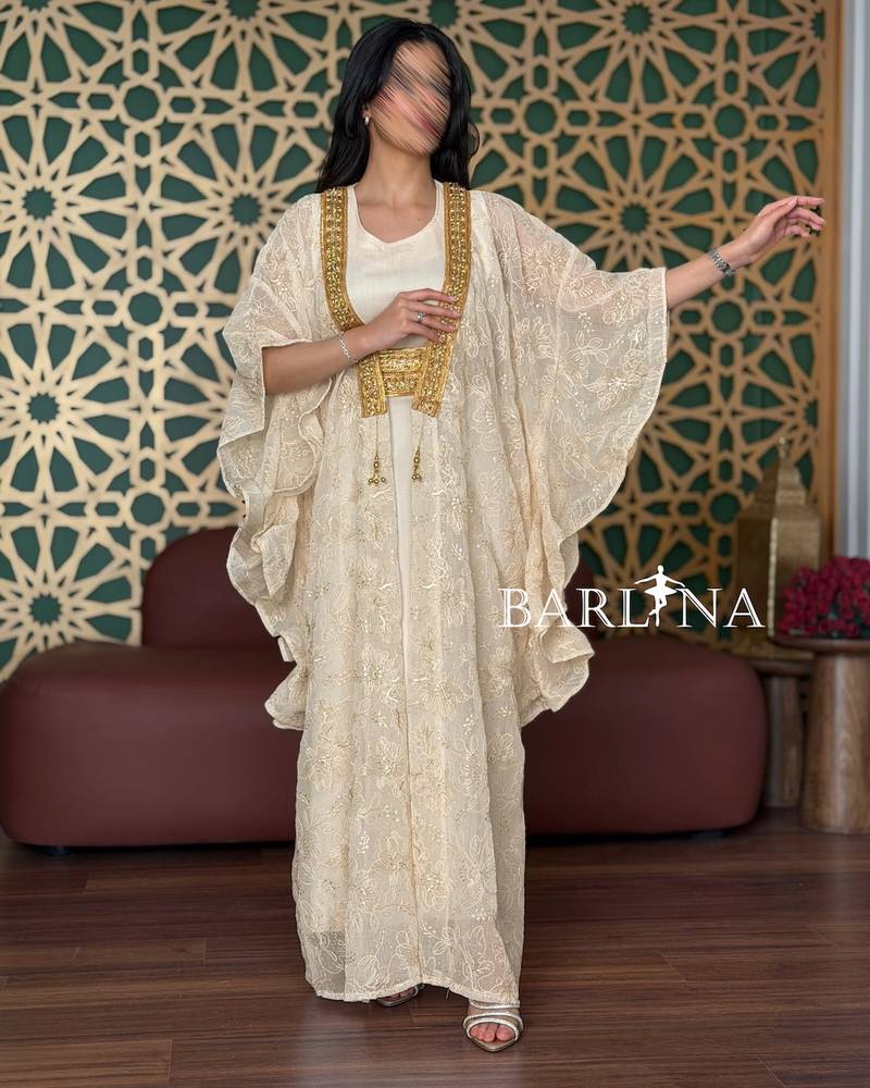 Beige jalabiya with a gold-embroidered lace shawl