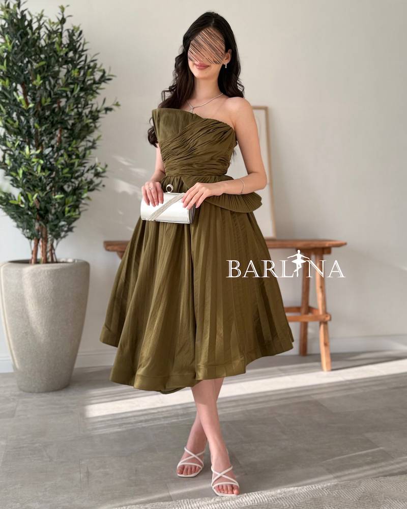 Olive green sleeveless dress with ruffled bodice