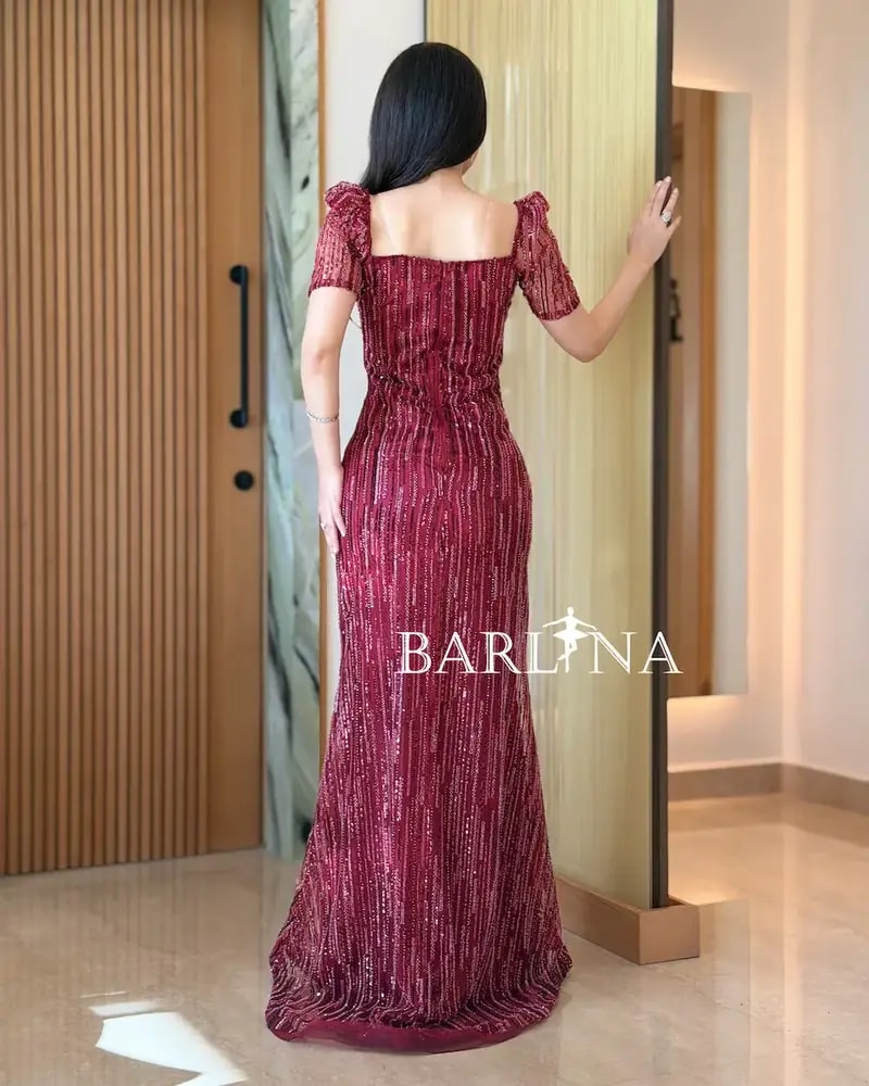 Elegant red evening dress adorned with shimmering lines