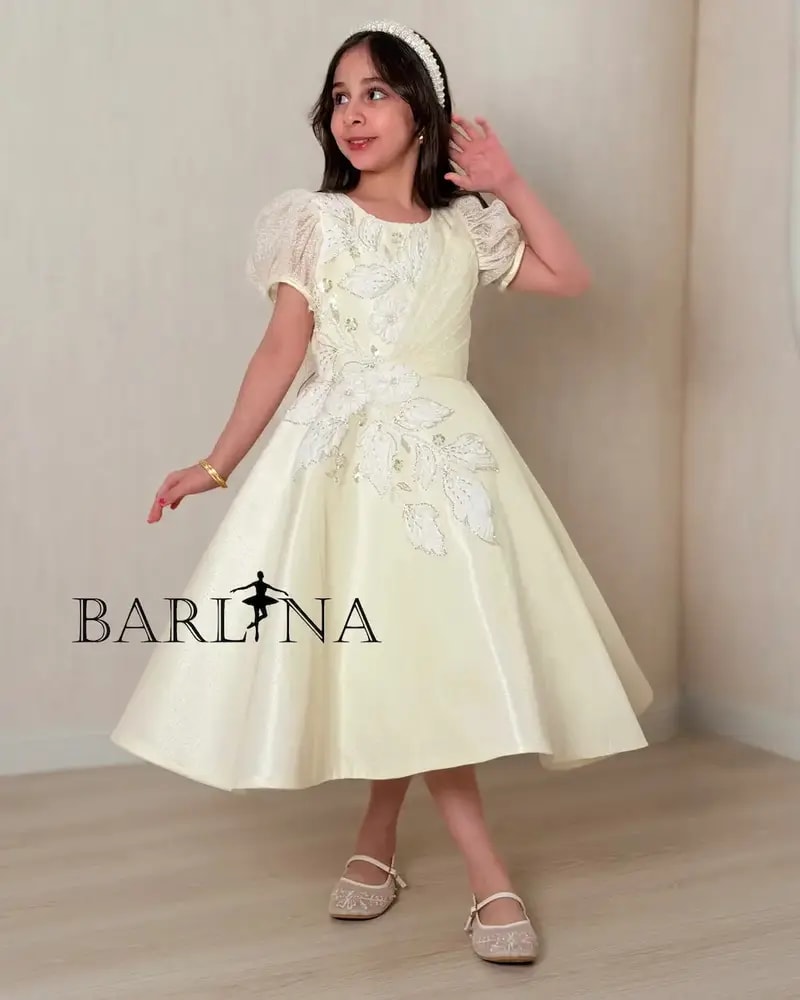 Lemon-colored girls' dress with elegant embroidery details