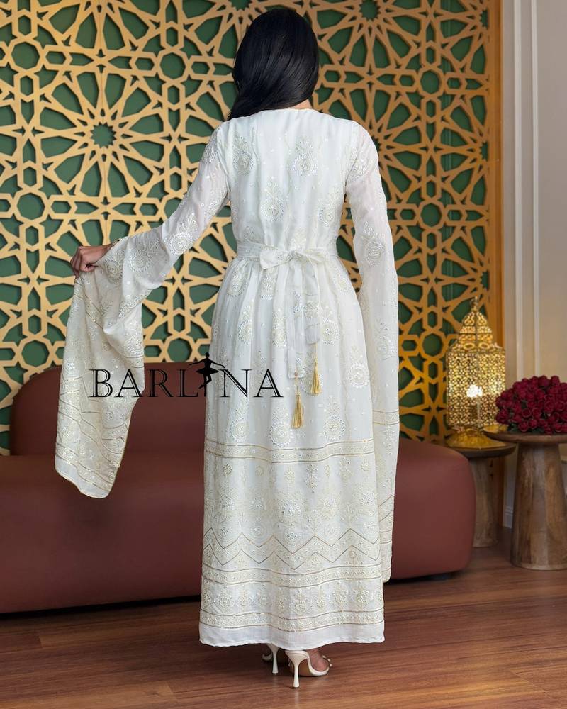 White jalabiya with delicate embroidery and gold accents