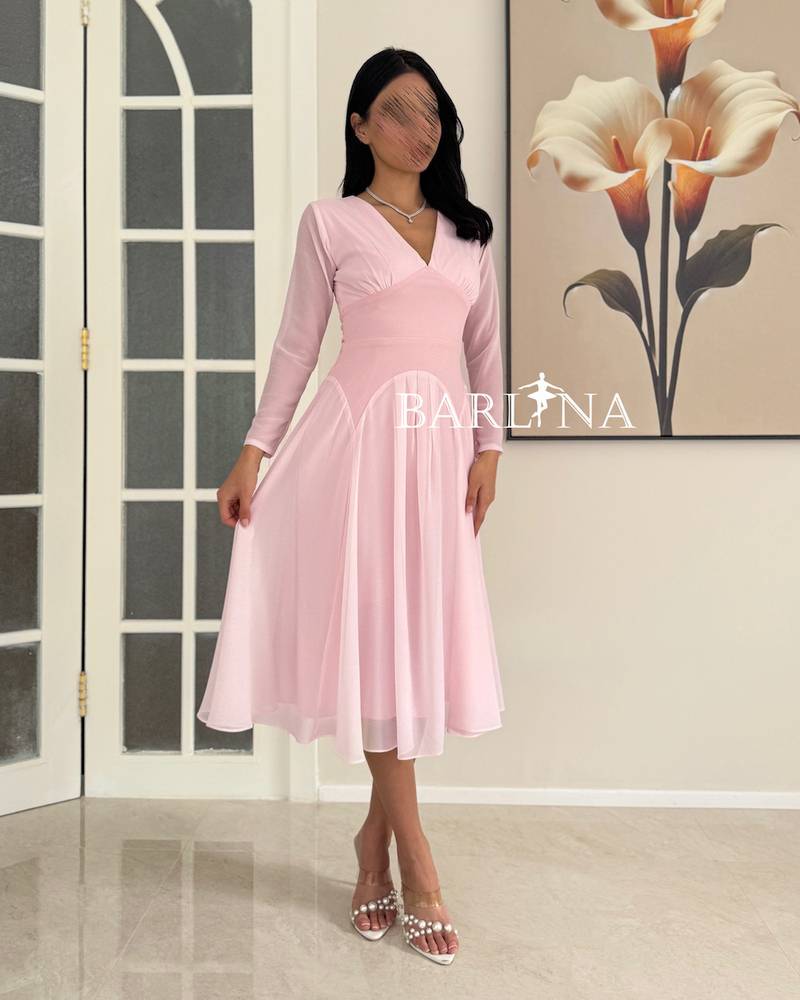 A light pink dress with soft and simple details
