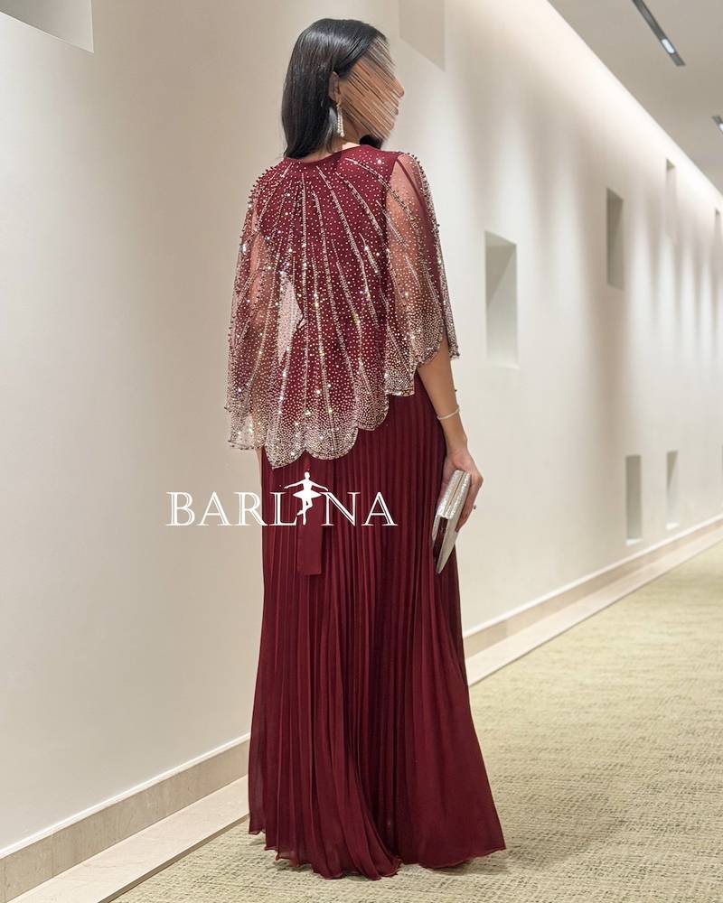 Loose burgundy dress with a beaded layer