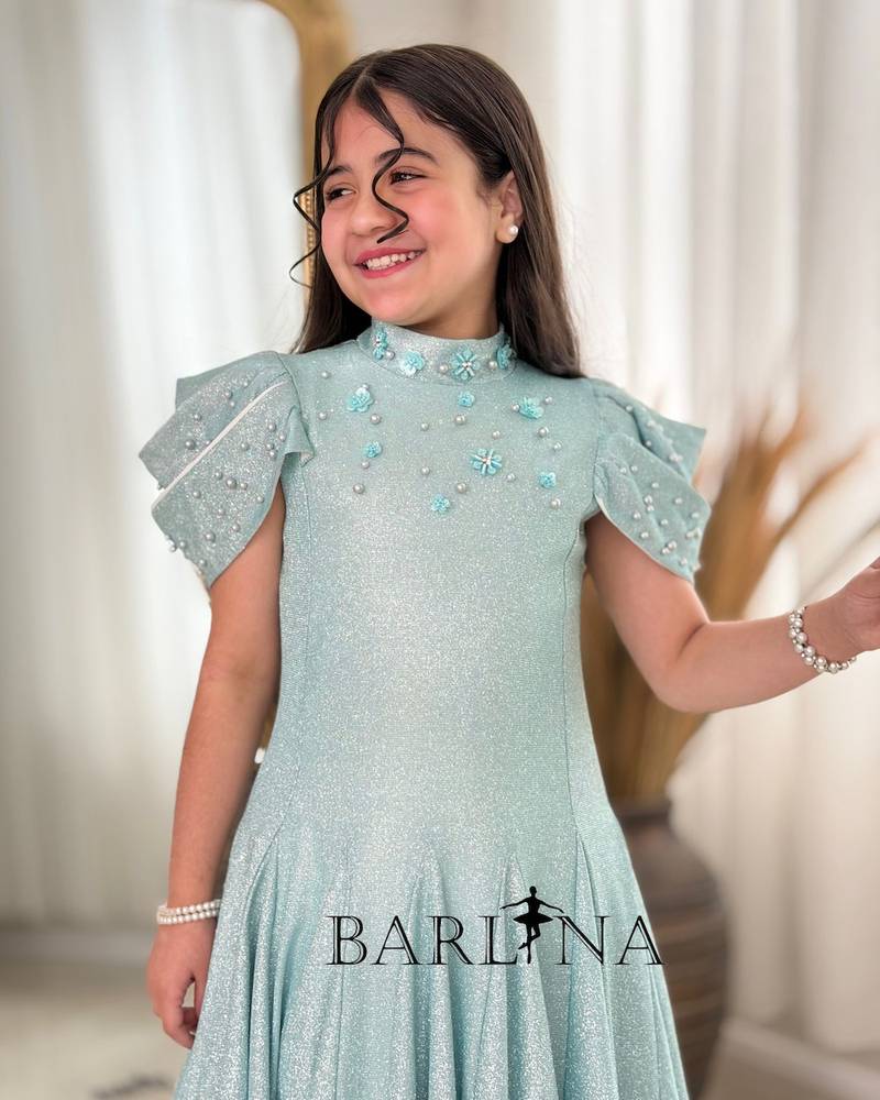 A sparkly girl's dress decorated with pearls