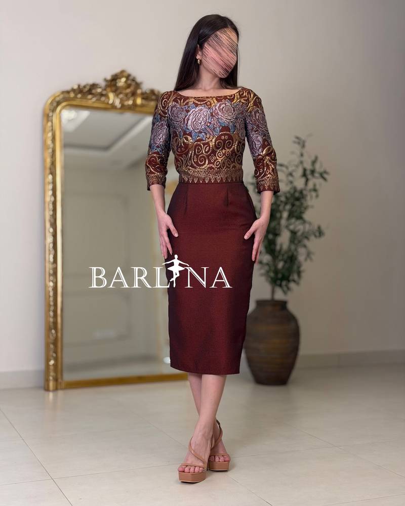 Black midi dress with a gold embroidered overlay