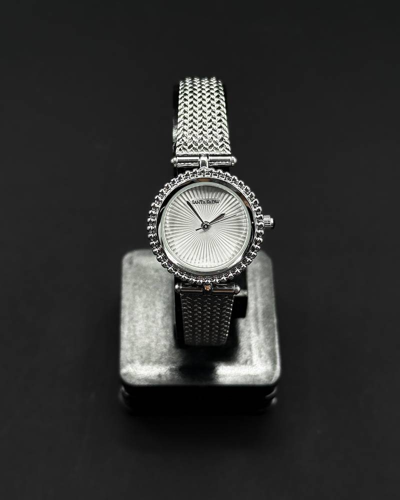 A classic round watch with a woven strap