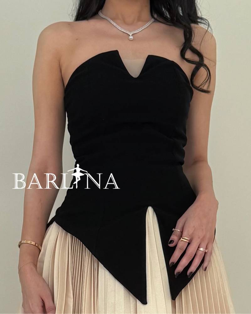 A soft, elegant dress with a corset cut and stylish pleats.