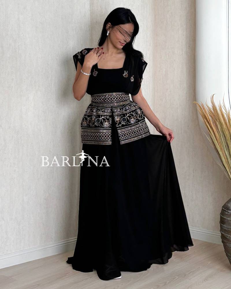 Long black jalabiya with elegant, harmonious embroidery