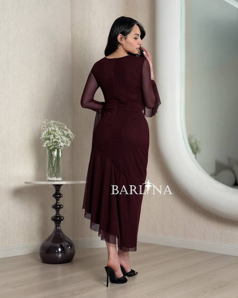 Burgundy dress with an asymmetrical cut