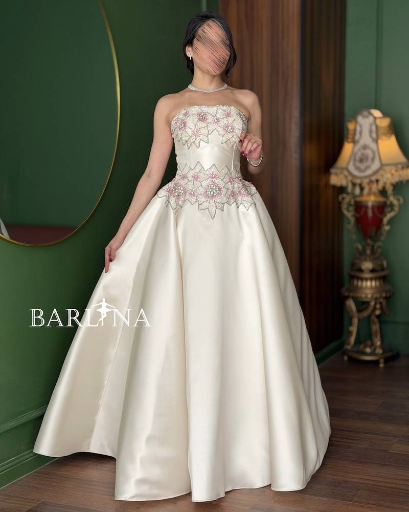 Off-white dress with a pearl-embroidered bodice
