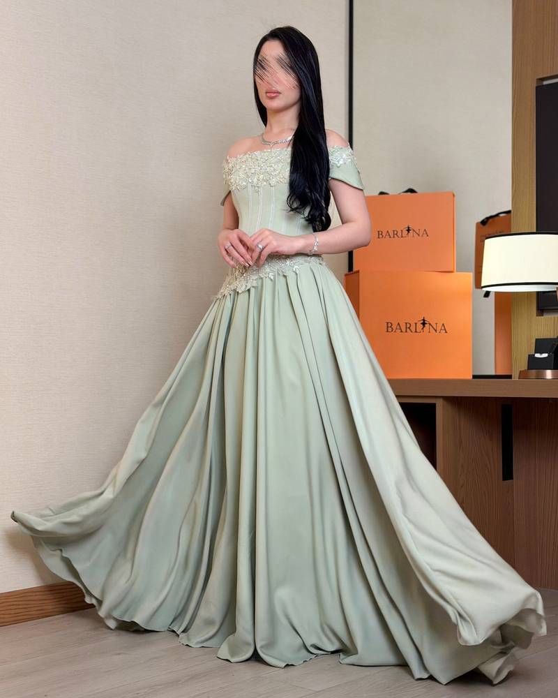 Luxurious light green off-the-shoulder evening dress
