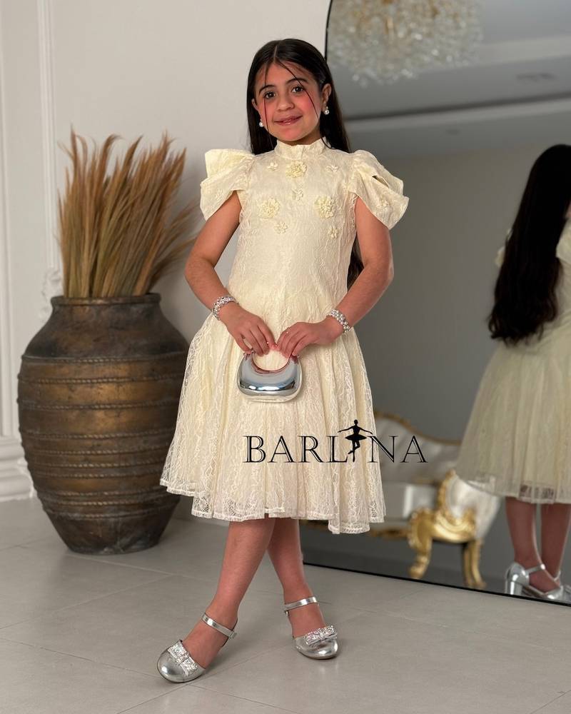 A soft girls’ lace dress with a feminine design