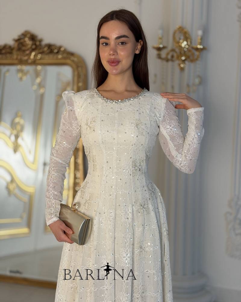 Elegant off-white dress with embroidery at the neckline